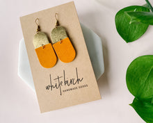 Load image into Gallery viewer, rusty tone leather earrings with d shaped brass accents