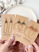 Load and play video in Gallery viewer, Distressed Brown Leather & Brass Oval Accent Earrings