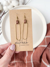 Load and play video in Gallery viewer, Distressed Brown Leather & Brass Oval Accent Earrings