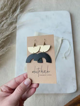 Load and play video in Gallery viewer, Black Leather Arc & Brass Half Moon Earrings