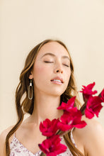 Load image into Gallery viewer, cream leather earrings on a brass oval