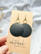 Load and play video in Gallery viewer, Large Black Leather Disc & Brass Hexagon Dangle Earrings