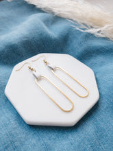 Load image into Gallery viewer, white leather on a brass oval earrings