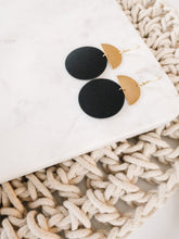 Load image into Gallery viewer, Black Leather Disc & Brass Half Moon Stacked Dangle Earrings.
