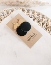 Load image into Gallery viewer, Black Leather Disc & Brass Half Moon Stacked Dangle Earrings.