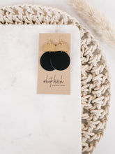 Load image into Gallery viewer, Black Leather Disc & Brass Half Moon Stacked Dangle Earrings.