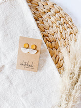 Load image into Gallery viewer, Mini White Sunburst Leather Half Moon and Brass Circle Post Earrings
