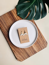 Load image into Gallery viewer, Smooth Cream Leather Arch and Tiny Brass Disc Earrings
