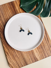 Load image into Gallery viewer, Smooth Black Leather Arch and Tiny Brass Disc Earrings
