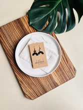 Load image into Gallery viewer, Smooth Black Leather Arch and Tiny Brass Disc Earrings

