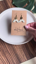 Load and play video in Gallery viewer, Smooth Cream Leather Arch and Tiny Brass Disc Earrings

