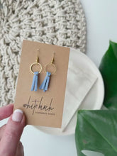 Load and play video in Gallery viewer, Mini Sky Blue Leather Tassel &amp; Brass Circle Earrings
