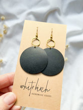 Load and play video in Gallery viewer, Large Black Leather Disc &amp; Brass Hexagon Dangle Earrings
