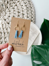 Load image into Gallery viewer, Mini Sky Blue Leather Tassel &amp; Brass Circle Earrings
