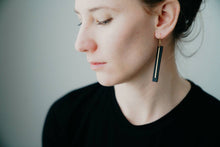 Load image into Gallery viewer, Black Leather Bar Earrings with a Thin Brass Bar Accent.
