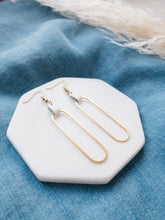 Load image into Gallery viewer, white leather on a brass oval earrings
