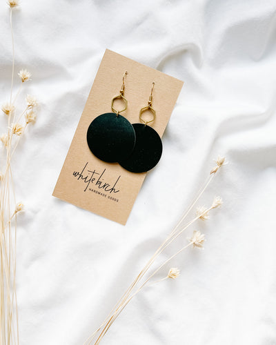 Large Black Leather Disc & Brass Hexagon Dangle Earrings.