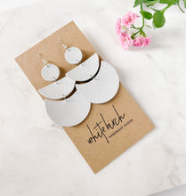 Load image into Gallery viewer, modern half circle earrings in a glossy white leather
